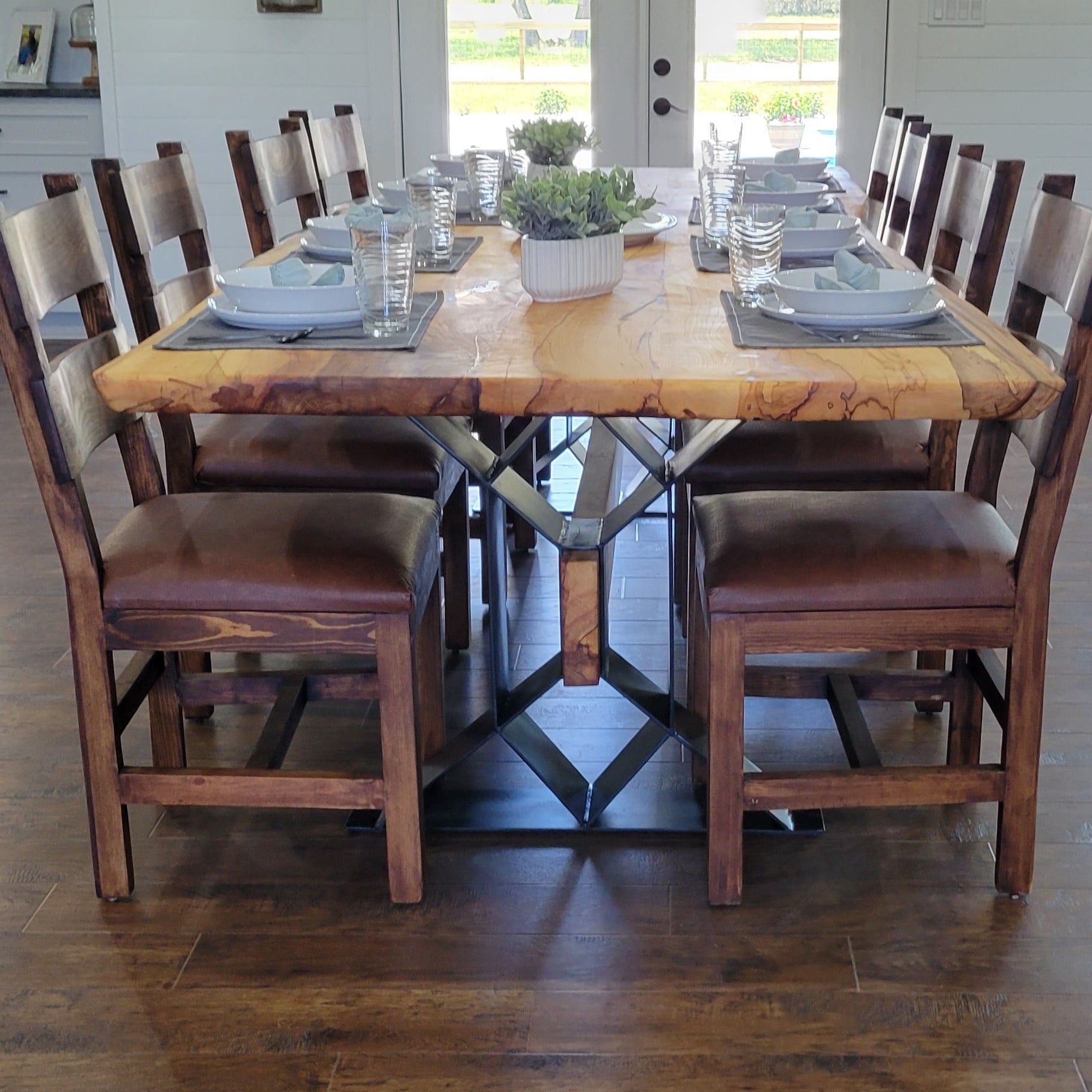 Large Elm Dining Table with geometric legs with elm beam crossing from one to the other.