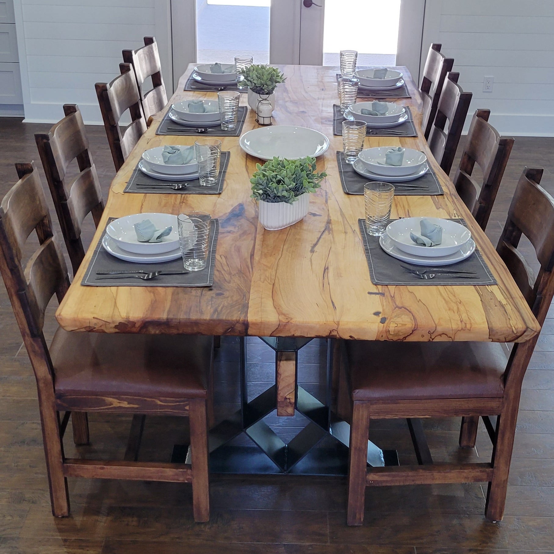 Large Elm Dining Table with geometric legs with elm beam crossing from one to the other.