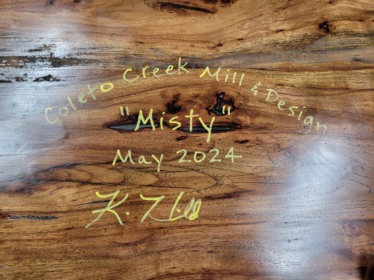 Rustic Pecan Live edge dining table with dark stain and semi-gloss finish.
