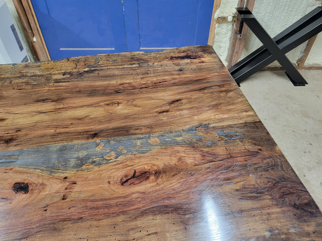 Rustic Pecan Live edge dining table with dark stain and semi-gloss finish.