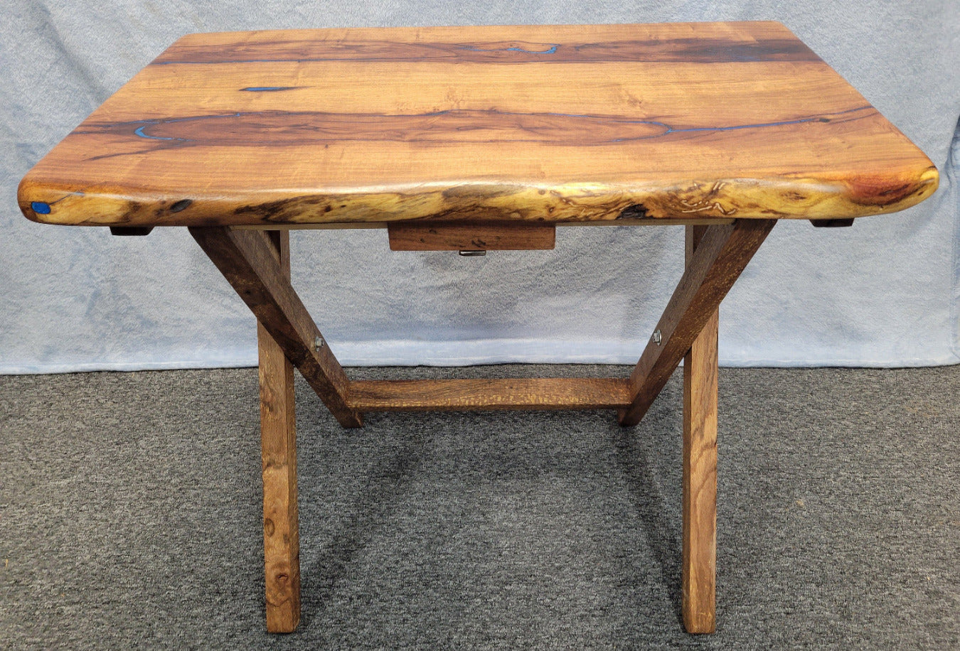 Mesquite live edge folding TV tray with blue epoxy fill and wooden folding legs