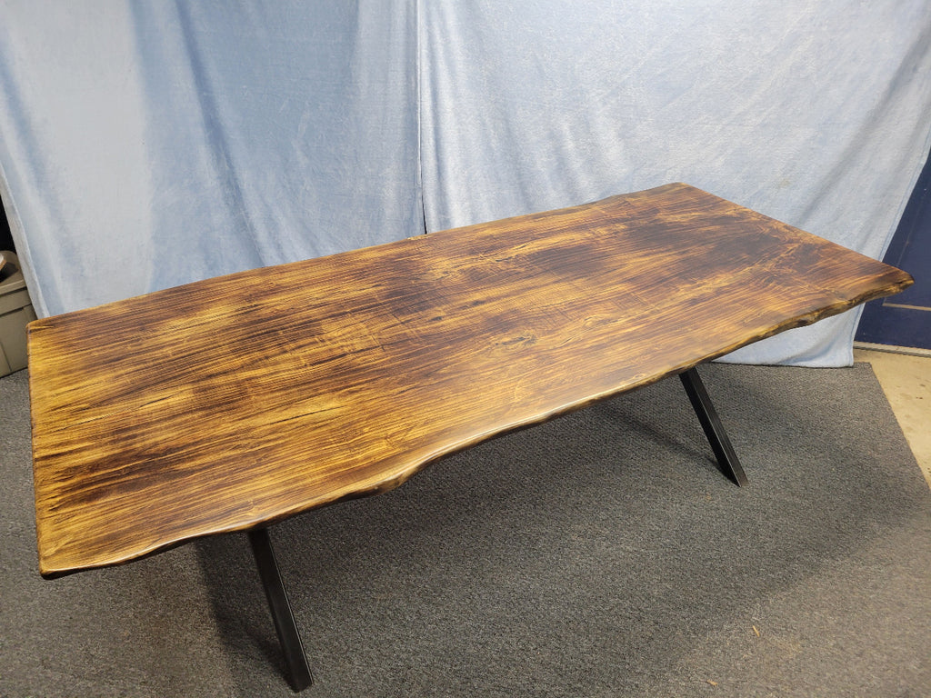 Ash dining table with Sho sugi ban burned top with black x-style metal legs
