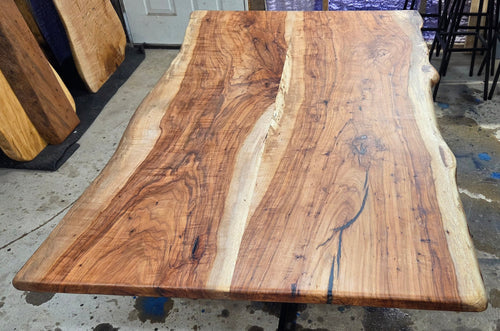 Live edge Pecan Breakfast table with black metal pedestal stand in natural color.