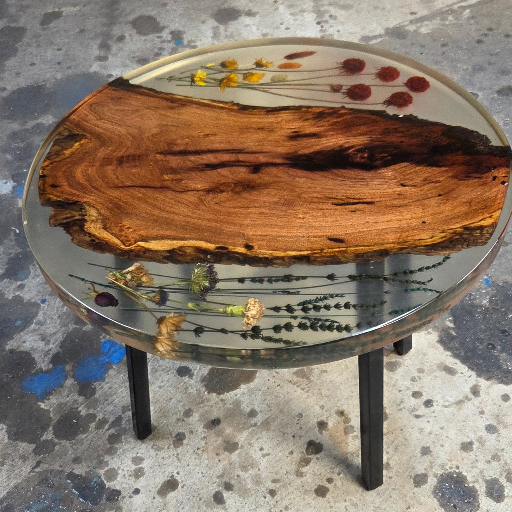 Epoxy End table with inlay-ed with Flowers and mesquite slab on black metal legs,