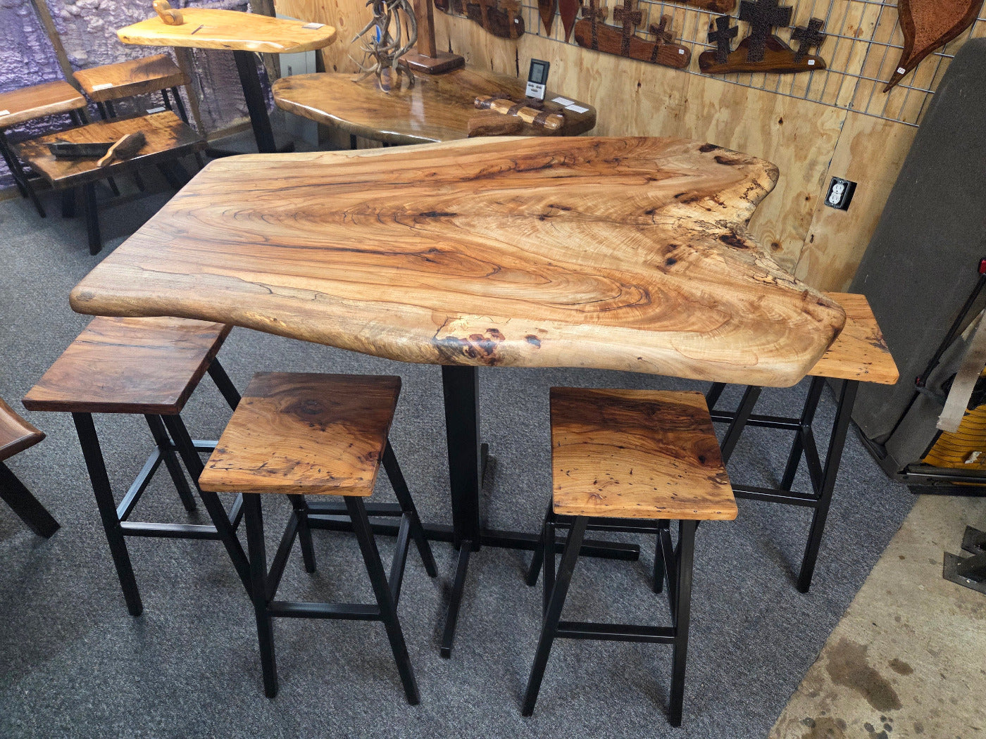 Live edge Burl Pecan Breakfast table with black metal pedestal legs and four matching pecan bar stools