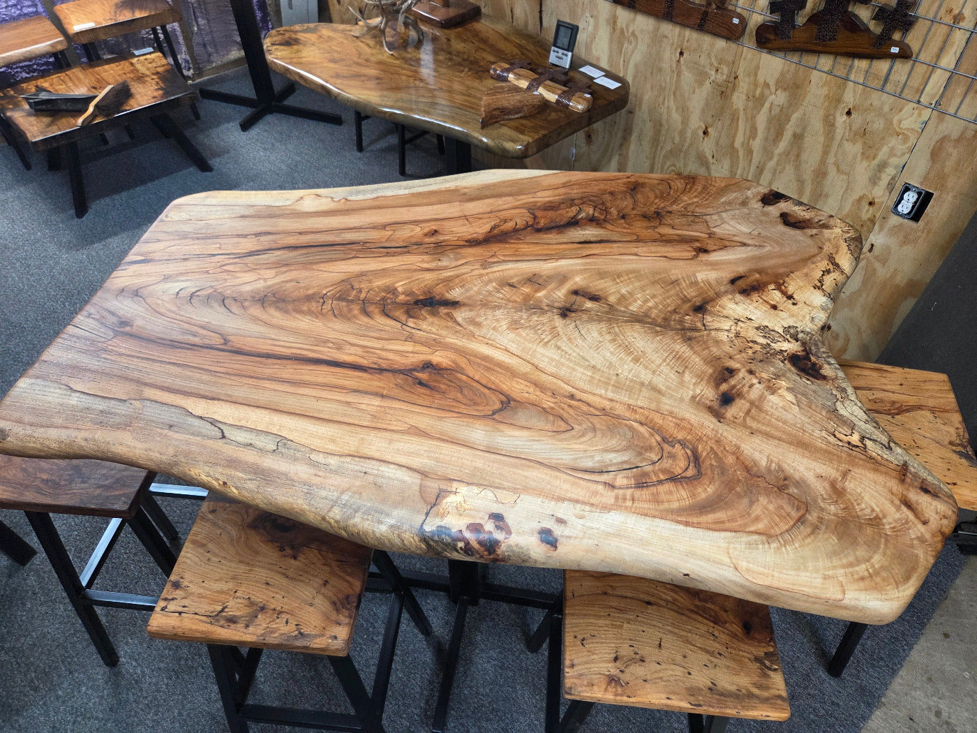 Live edge Burl Pecan Breakfast table with black metal pedestal legs and four matching pecan bar stools