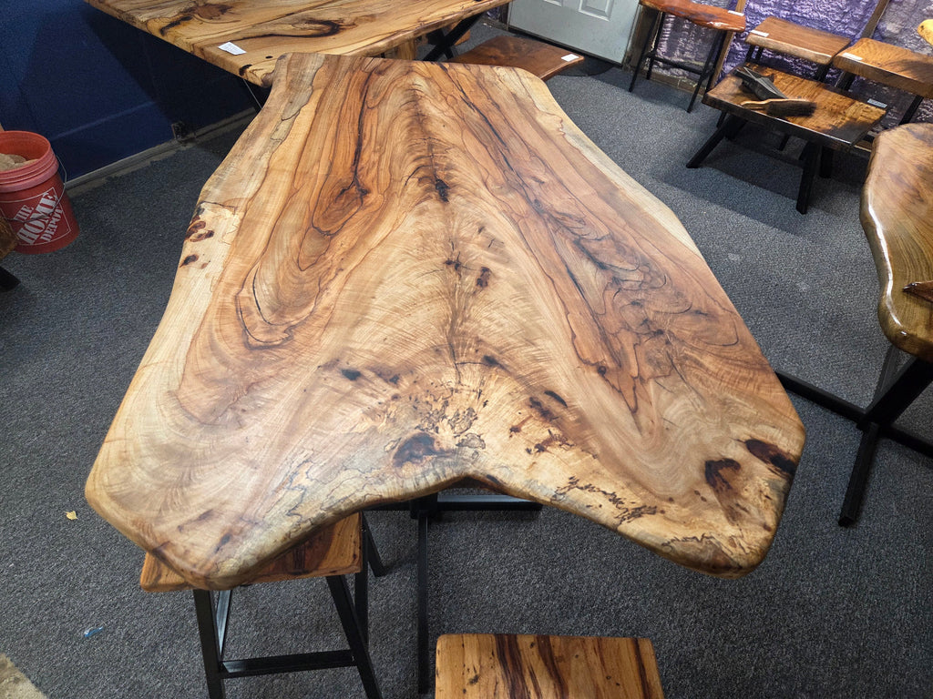 Live edge Burl Pecan Breakfast table with black metal pedestal legs and four matching pecan bar stools