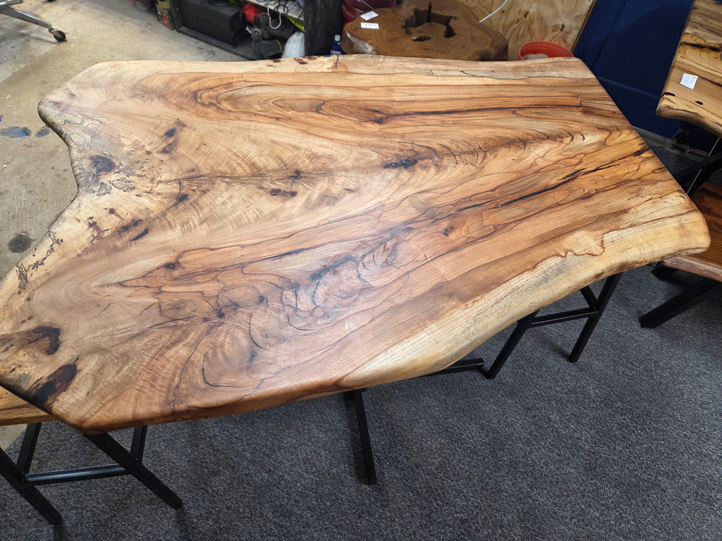 Live edge Burl Pecan Breakfast table with black metal pedestal legs and four matching pecan bar stools