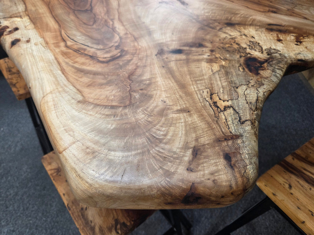 Live edge Burl Pecan Breakfast table with black metal pedestal legs and four matching pecan bar stools