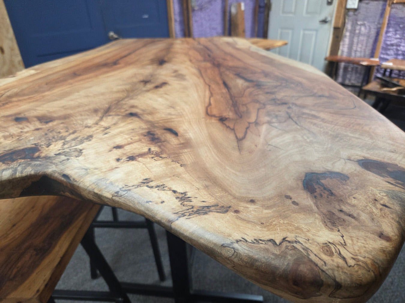 Live edge Burl Pecan Breakfast table with black metal pedestal legs and four matching pecan bar stools
