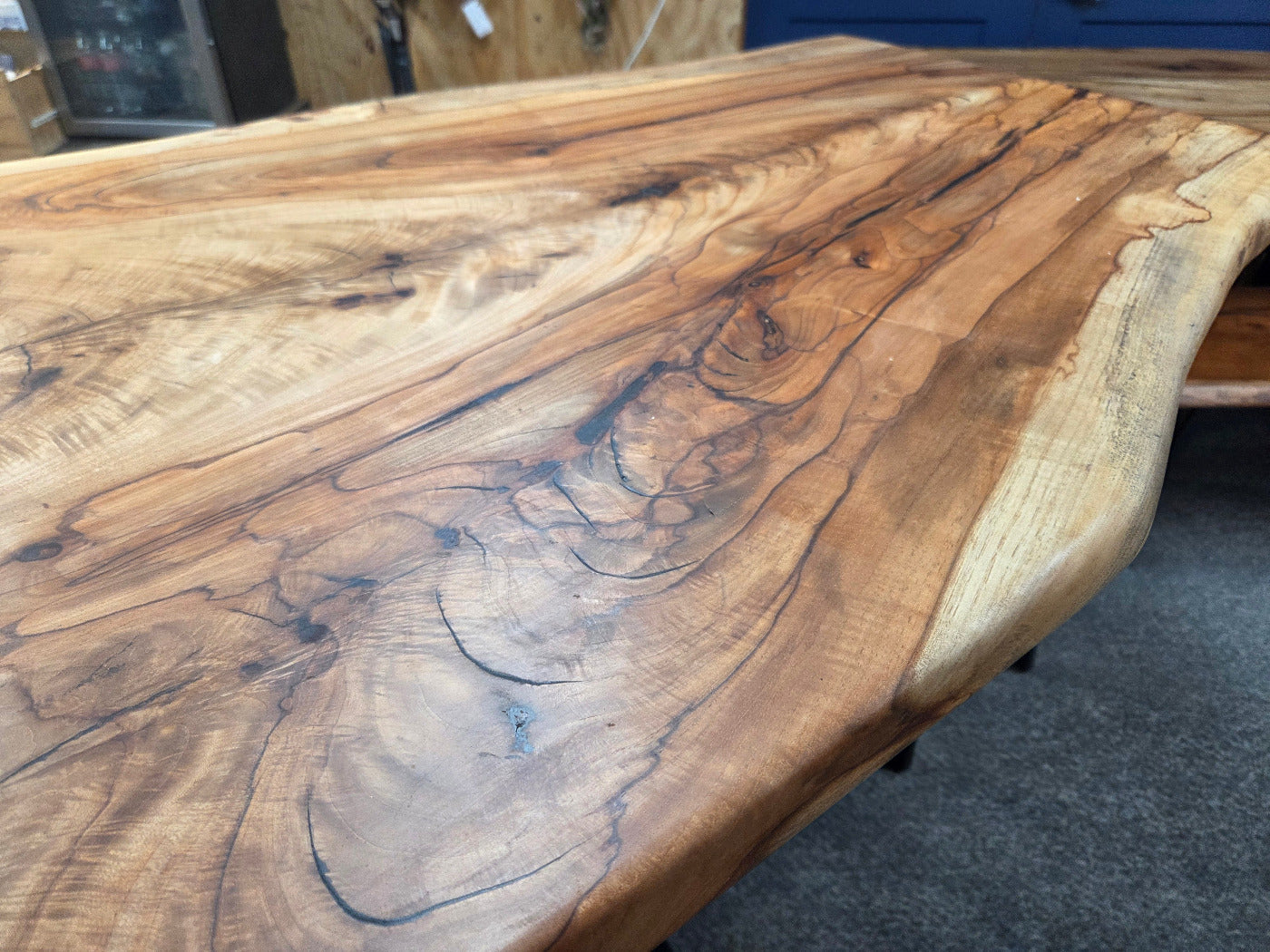 Live edge Burl Pecan Breakfast table with black metal pedestal legs and four matching pecan bar stools