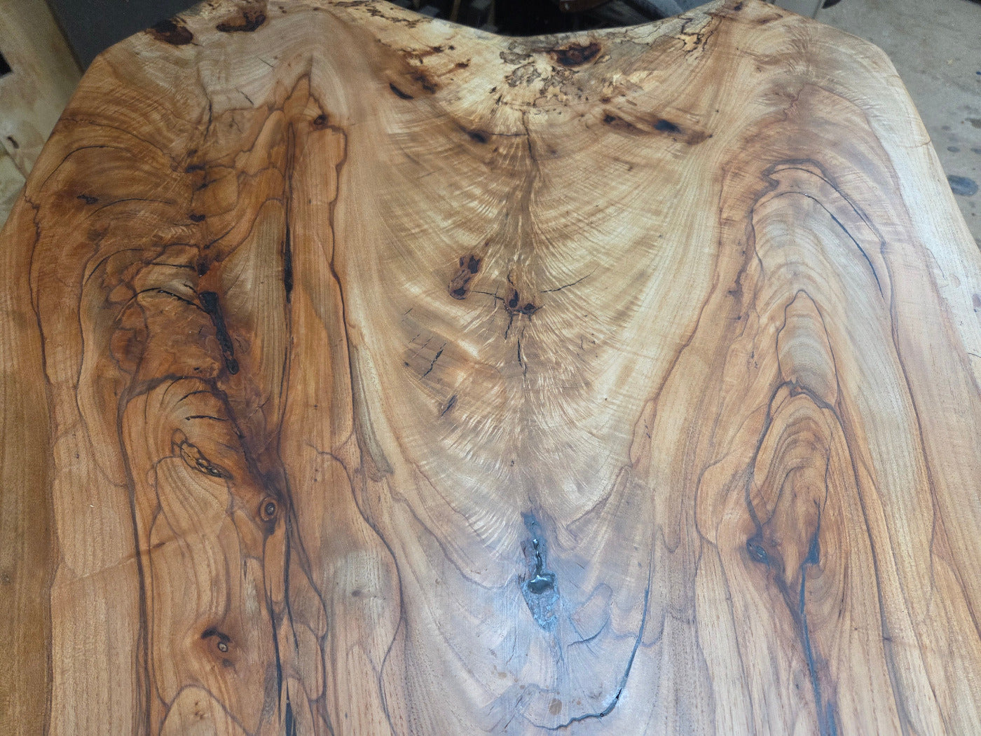 Live edge Burl Pecan Breakfast table with black metal pedestal legs and four matching pecan bar stools