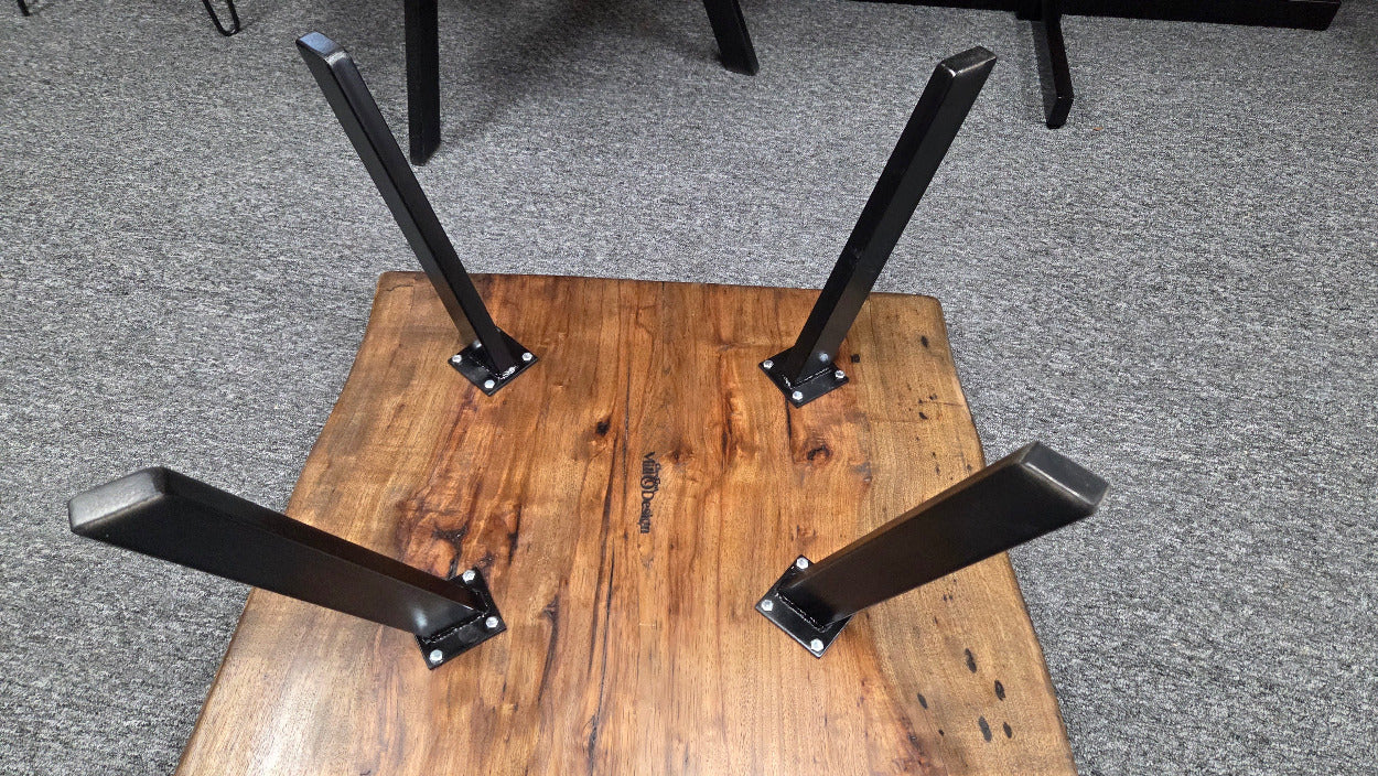 Pecan coffee table with a rustic finish and sho sugi bon treatment with black metal legs