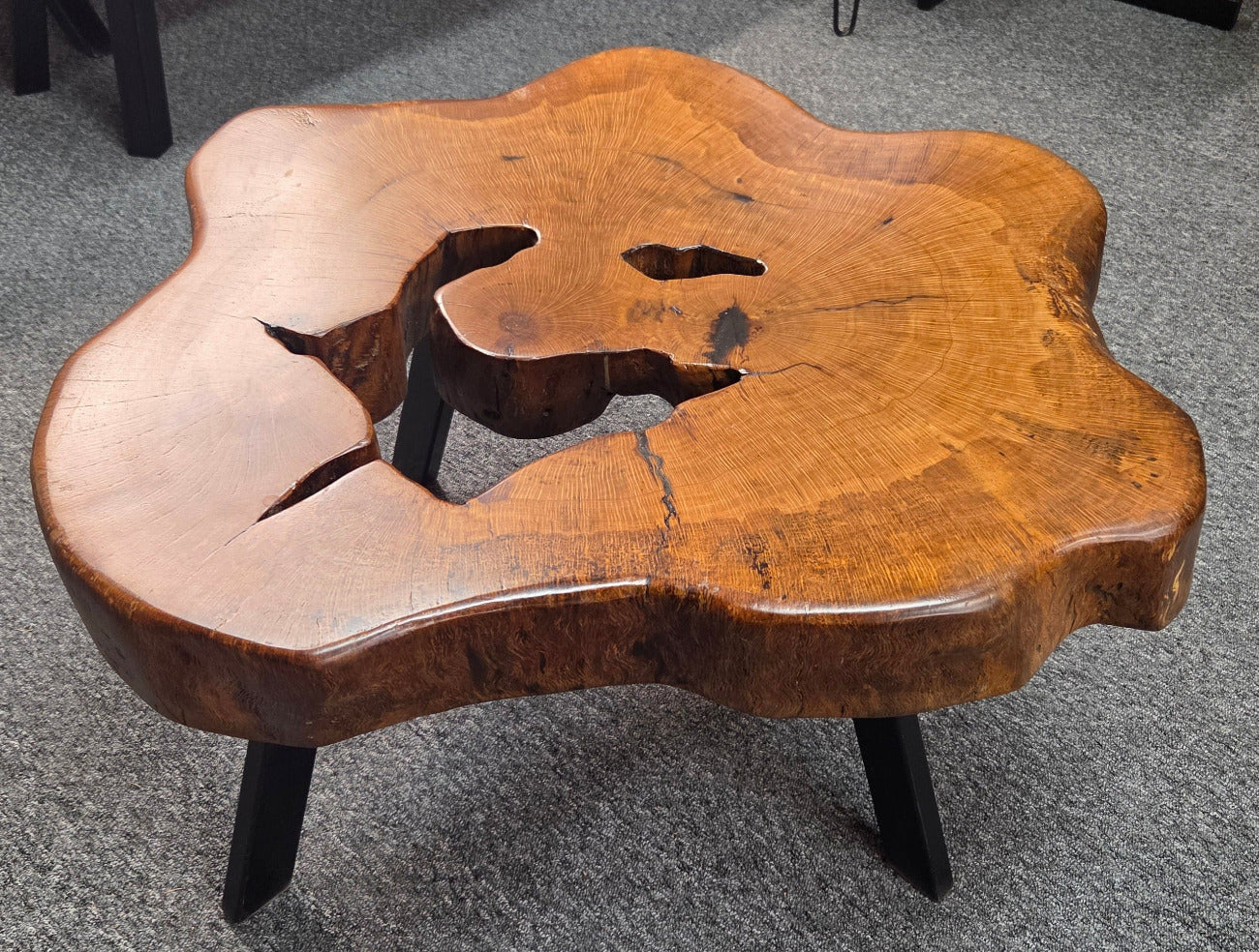 Large Live Oak Coffee Table with organic live edge shape, hole in the center section with black metal legs