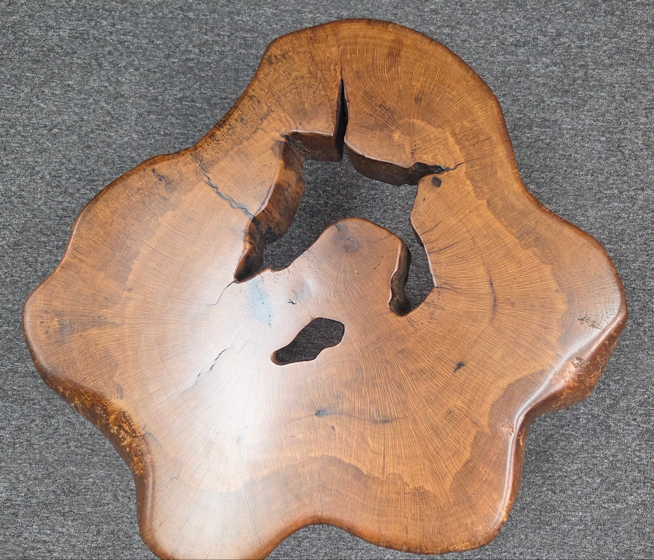 Large Live Oak Coffee Table with organic live edge shape, hole in the center section with black metal legs