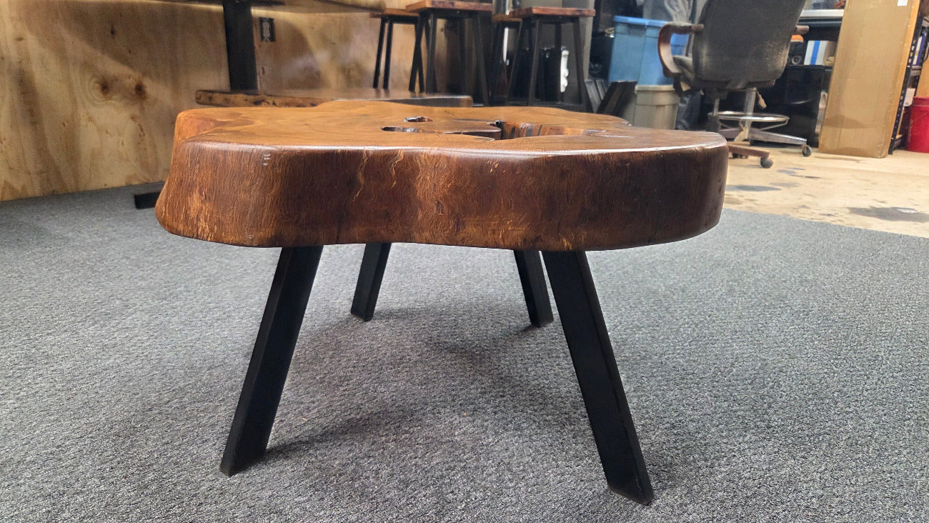 Large Live Oak Coffee Table with organic live edge shape, hole in the center section with black metal legs