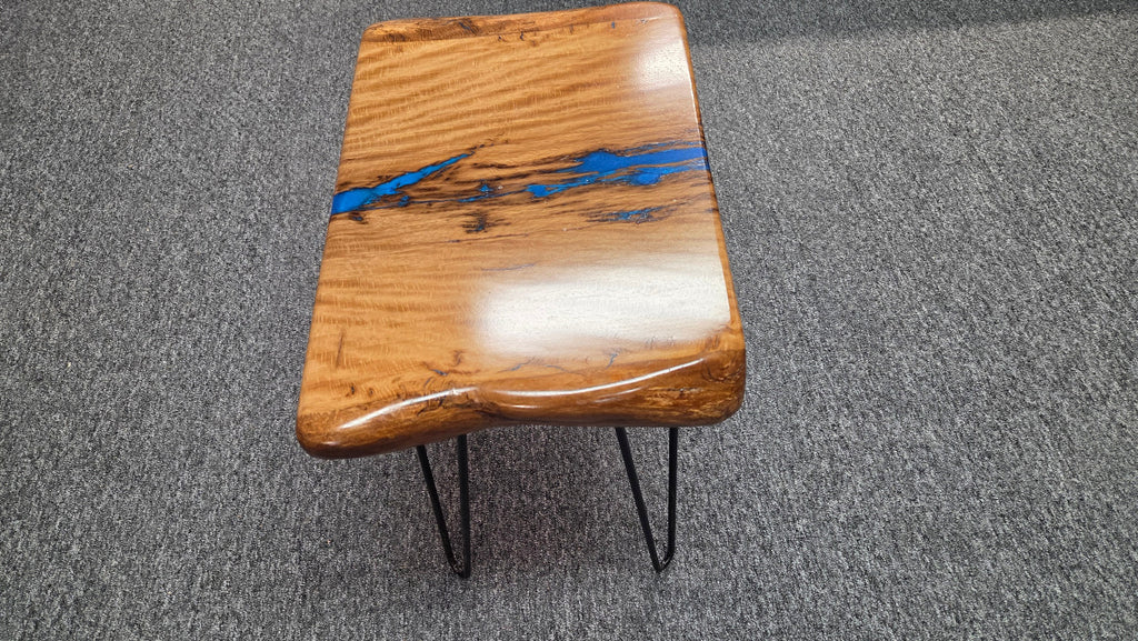 Live oak End table featuring live edge sides with blue epoxy inlay on black hair pin legs