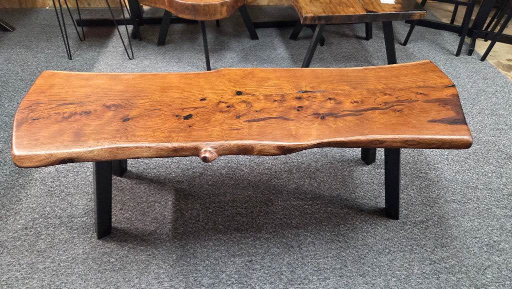beautiful Bois D'Arc Bench Live edge rustic with black metal legs.