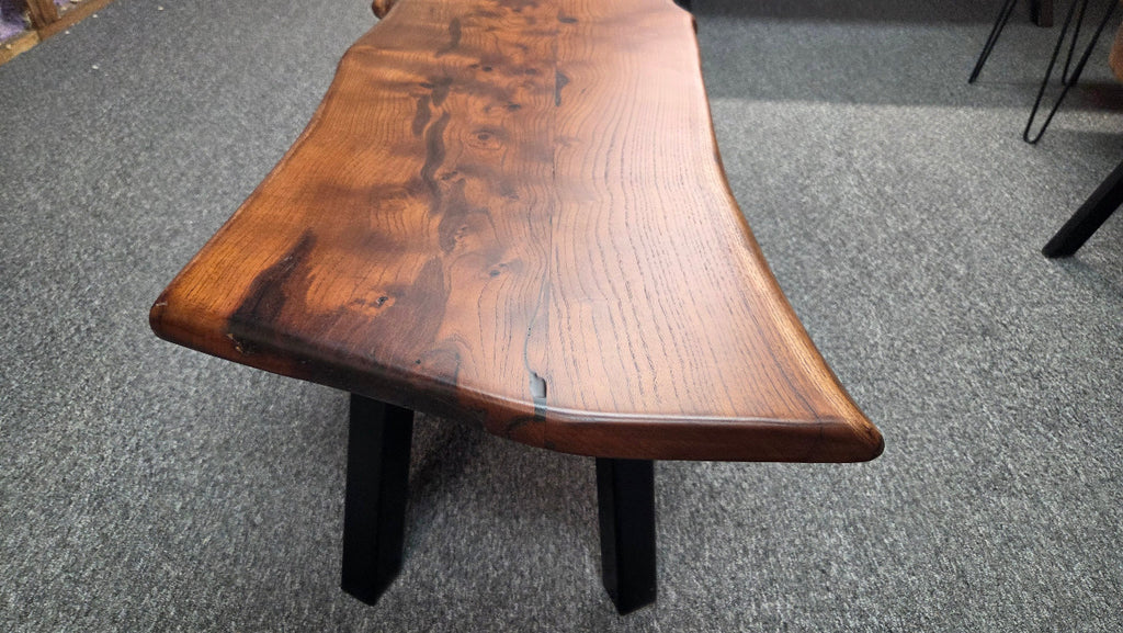 beautiful Bois D'Arc Bench Live edge rustic with black metal legs.