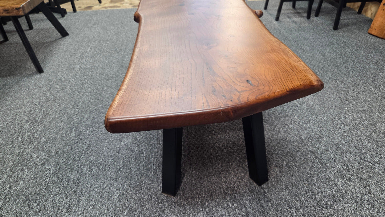 beautiful Bois D'Arc Bench Live edge rustic with black metal legs.