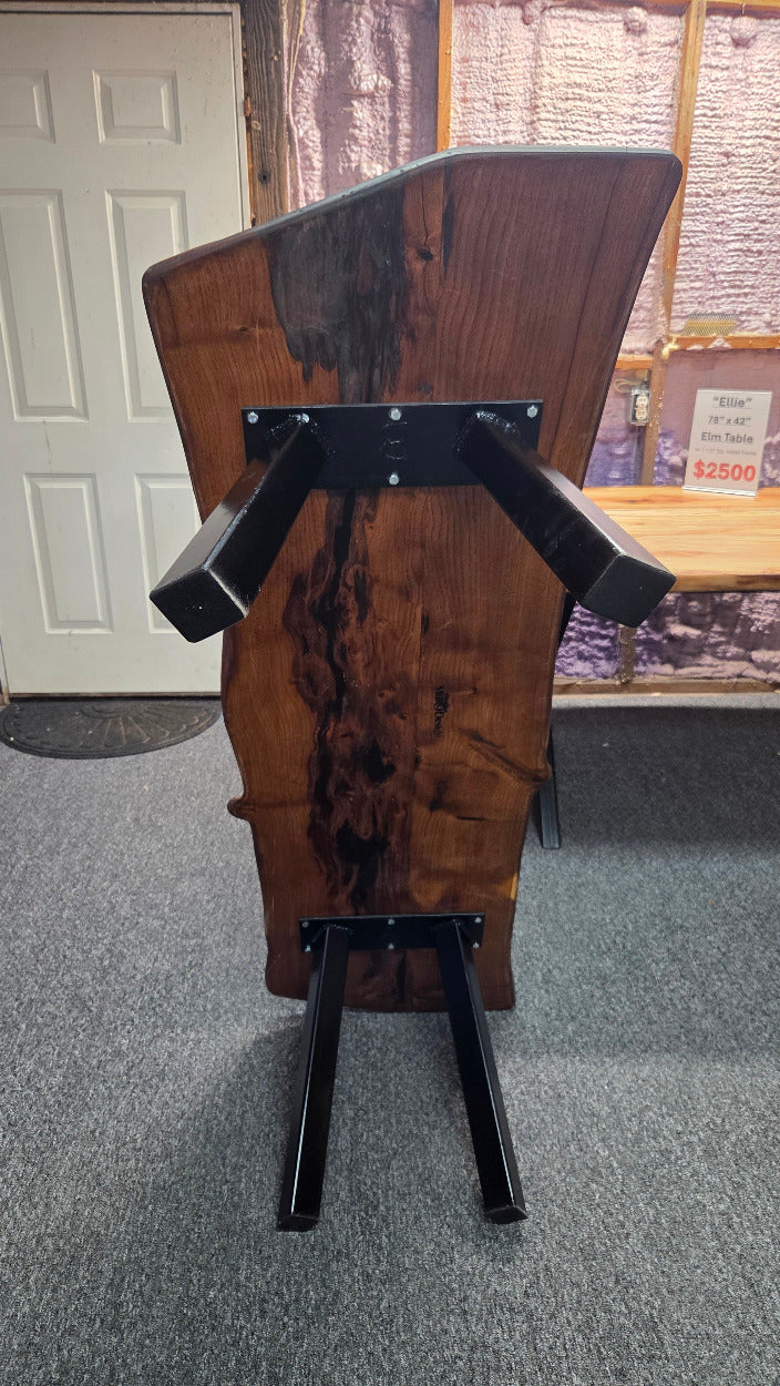 beautiful Bois D'Arc Bench Live edge rustic with black metal legs.