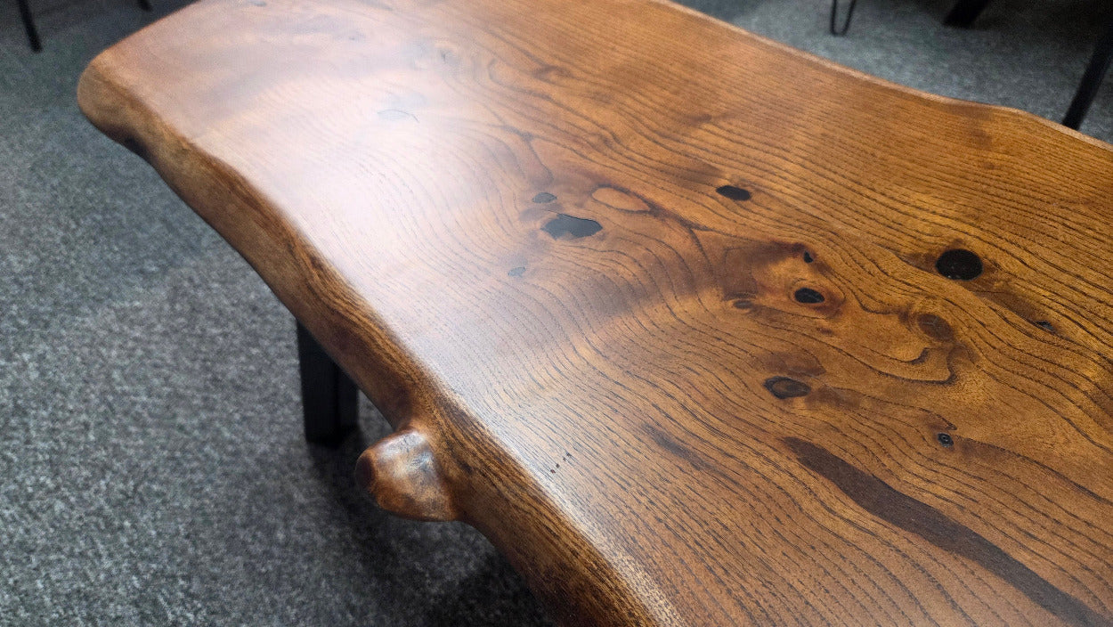 beautiful Bois D'Arc Bench Live edge rustic with black metal legs.
