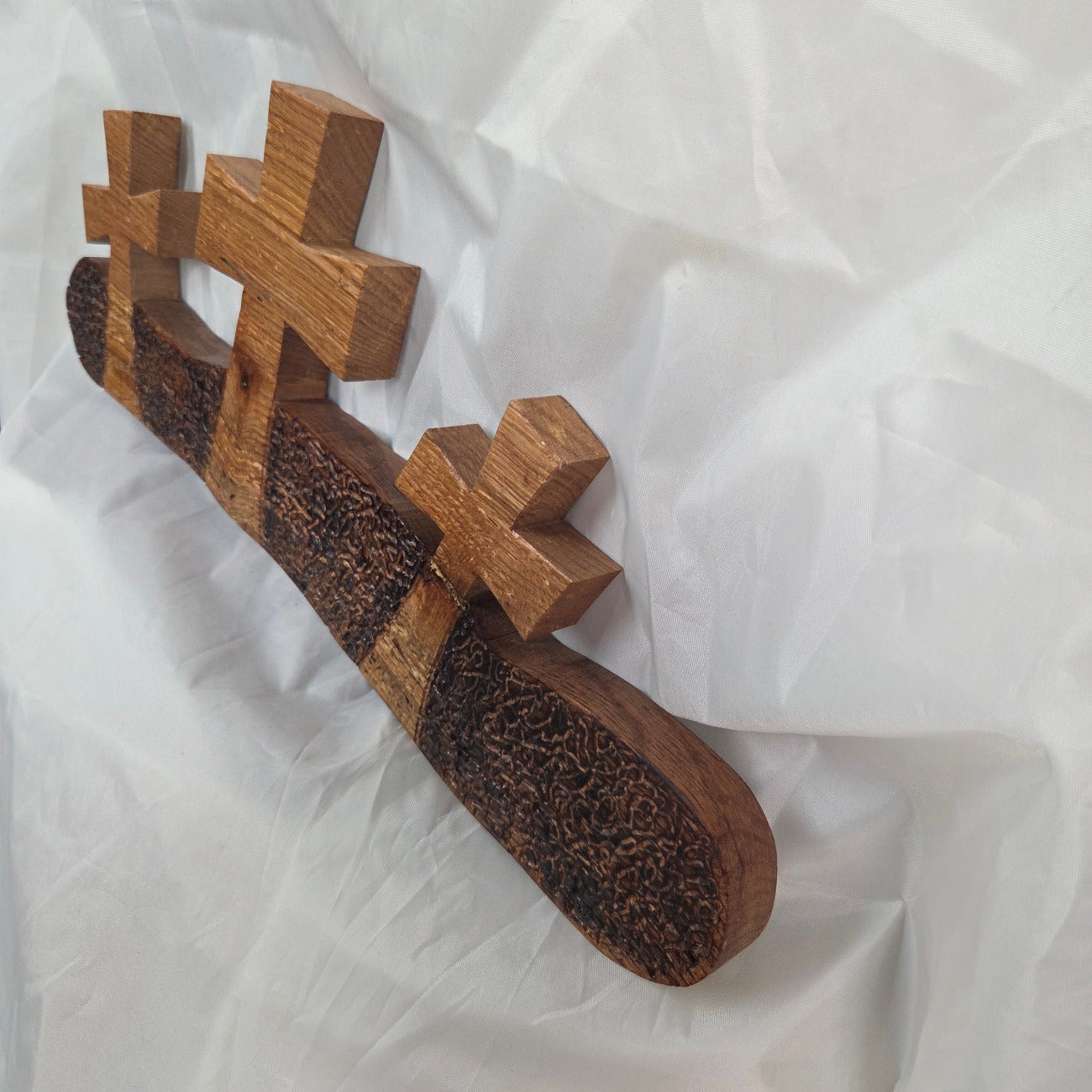 White Oak slab hand carved with three crosses cut out. Sho Sugi Bon burned