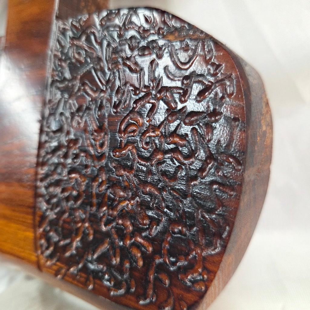 A Bois D'Arc decorative wall plaque featuring three stylized Christian crosses cut from a single slab, hand carved with burned finish sho sugi ban with natural grain 