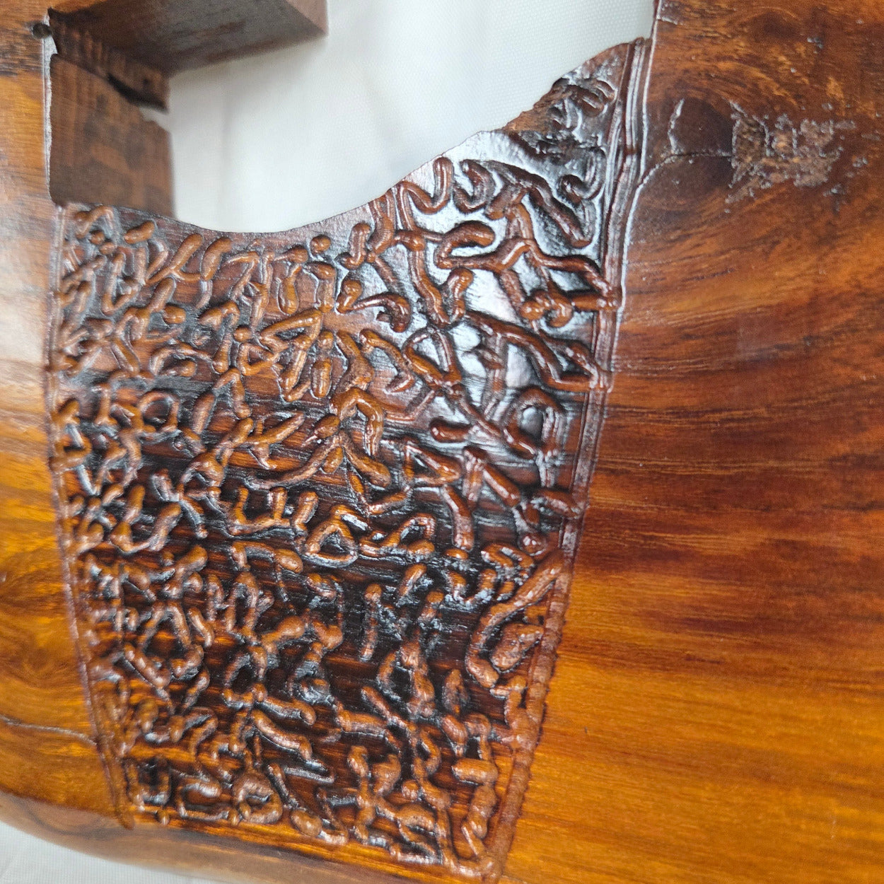 A Bois D'Arc decorative wall plaque featuring three stylized Christian crosses cut from a single slab, hand carved with burned finish sho sugi ban with natural grain 