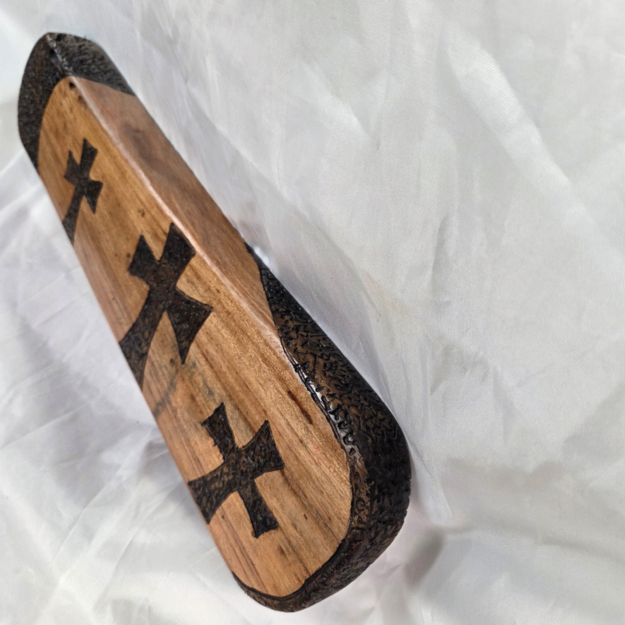 Pecan Wall sign with three hand carved crosses and carved sides. natural edges