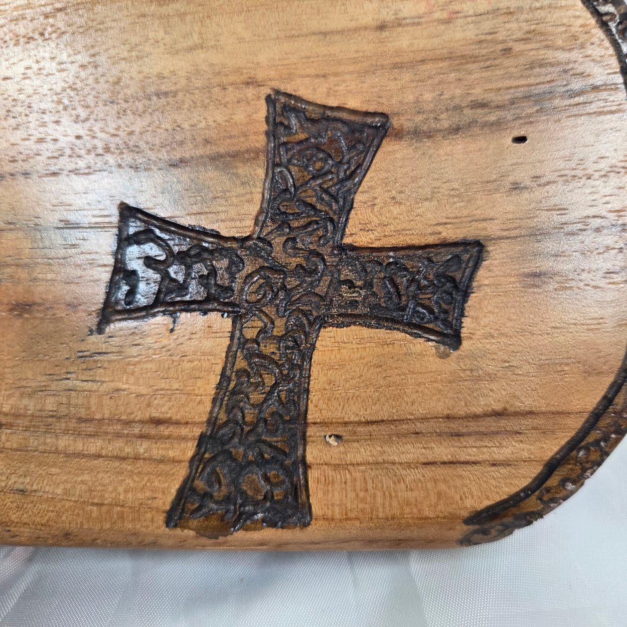 Pecan Wall sign with three hand carved crosses and carved sides. natural edges