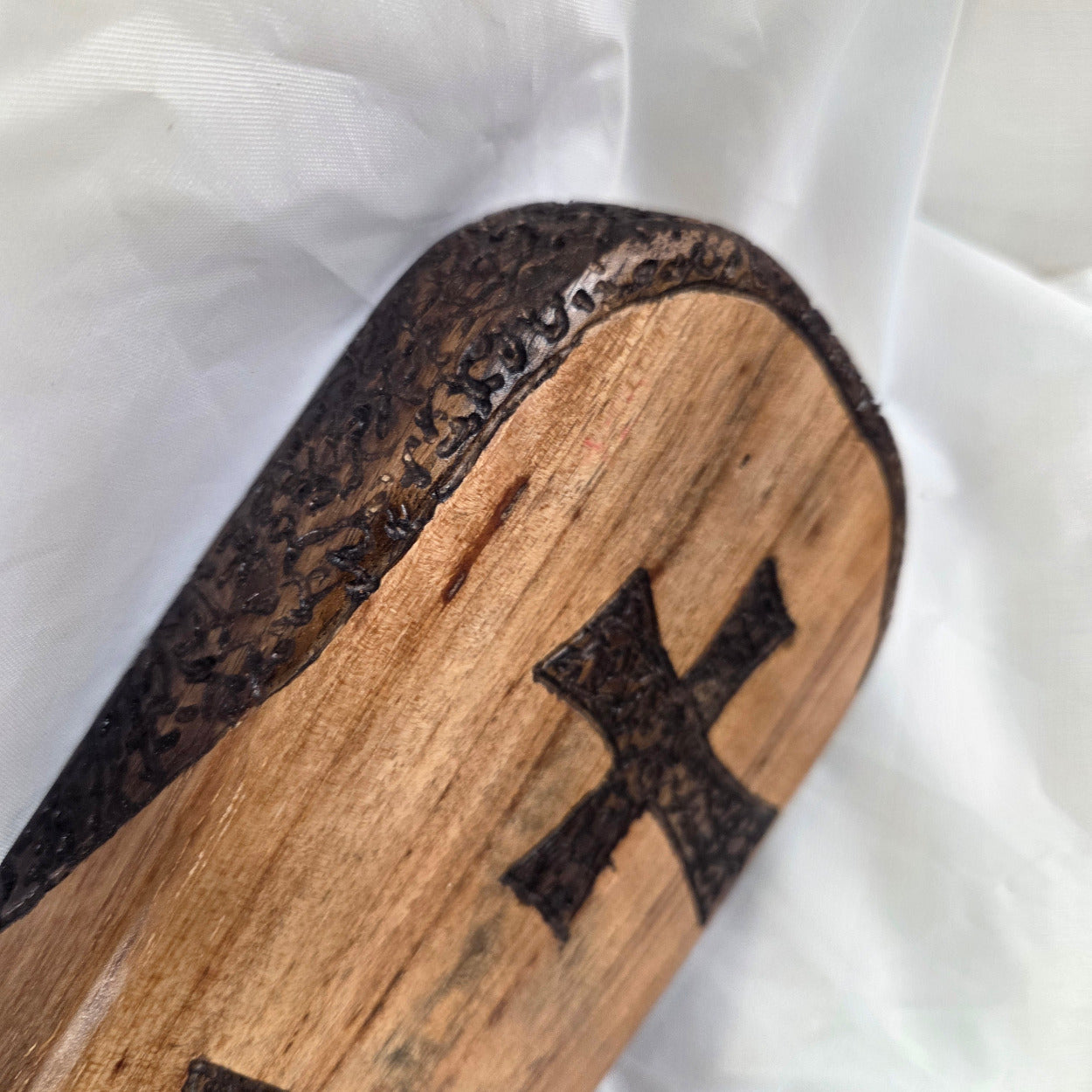 Pecan Wall sign with three hand carved crosses and carved sides. natural edges