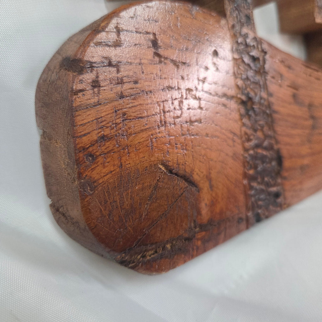 A white oak decorative wall plaque featuring three stylized Christian crosses cut from a single slab, hand carved with burned finish sho sugi ban with natural grain 