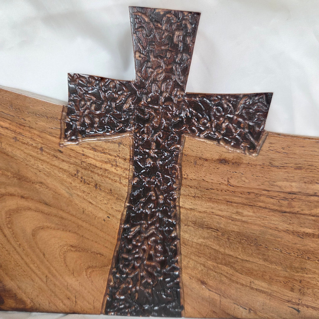 A Pecan decorative wall plaque featuring three stylized Christian crosses cut from a single slab, hand carved with burned finish sho sugi ban with natural grain 