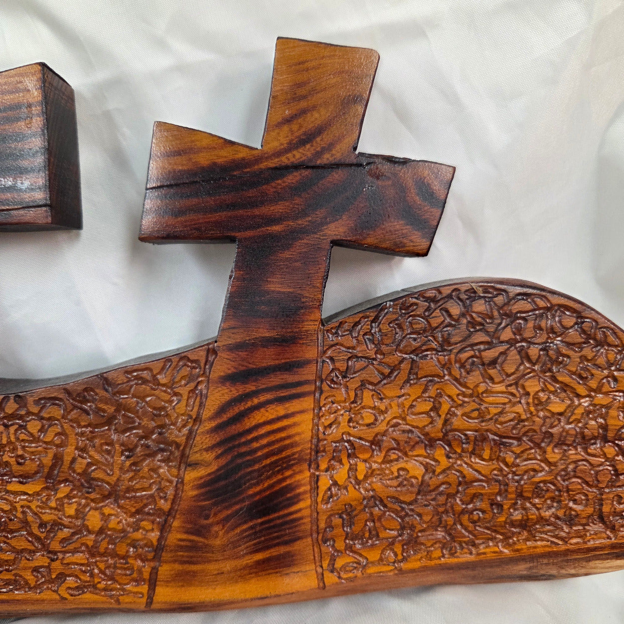 A Bois D'Arc decorative wall plaque featuring three stylized Christian crosses cut from a single slab, hand carved with burned finish sho sugi ban