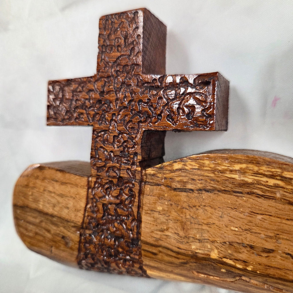 A white oak decorative wall plaque featuring three stylized Christian crosses cut from a single slab, hand carved with dark brown stained crosses and natural color base