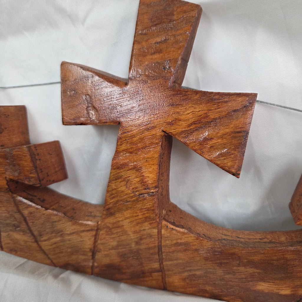Three crosses landscape wall art hand cut from a single piece of Pecan, honey oak stained