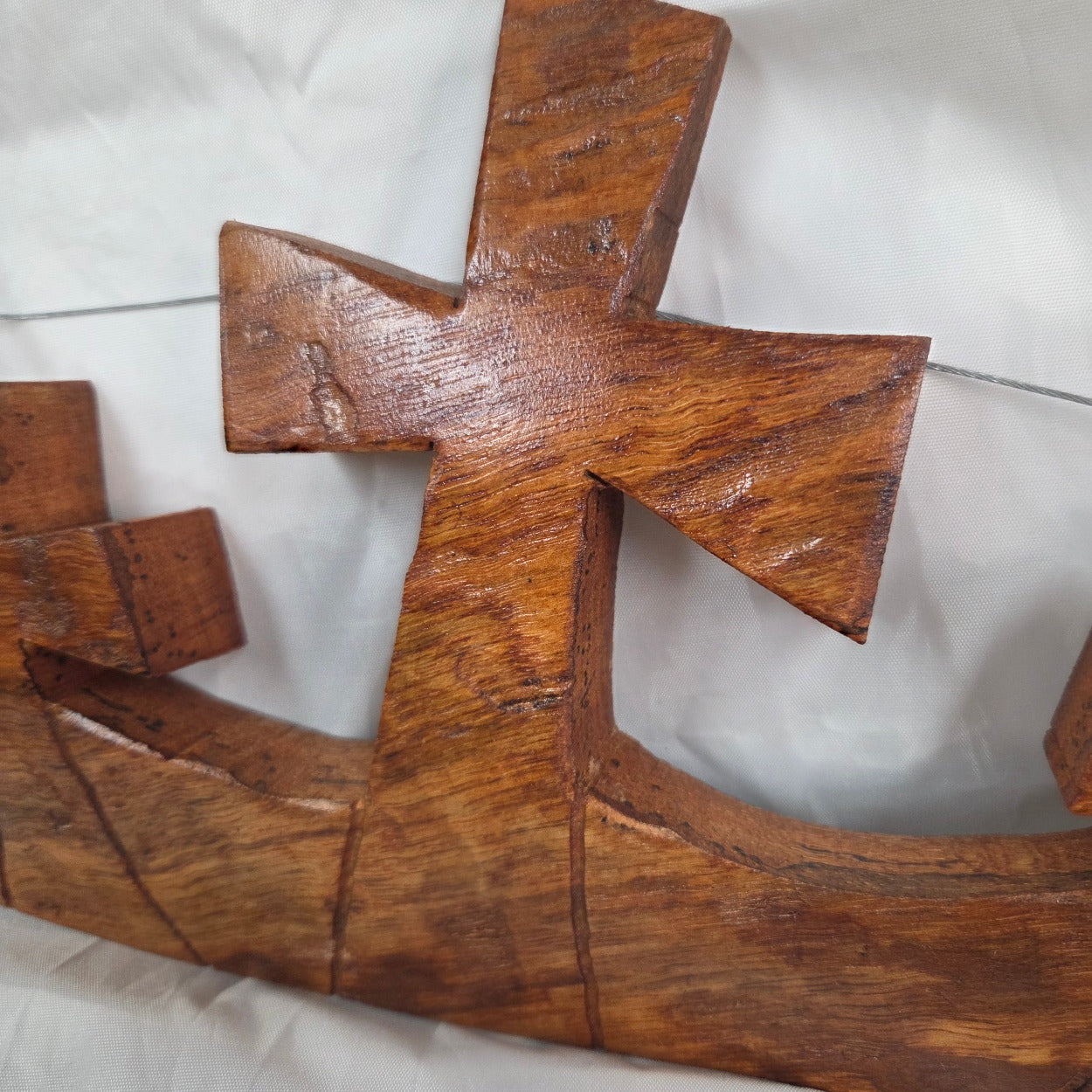 Three crosses landscape wall art hand cut from a single piece of Pecan, honey oak stained