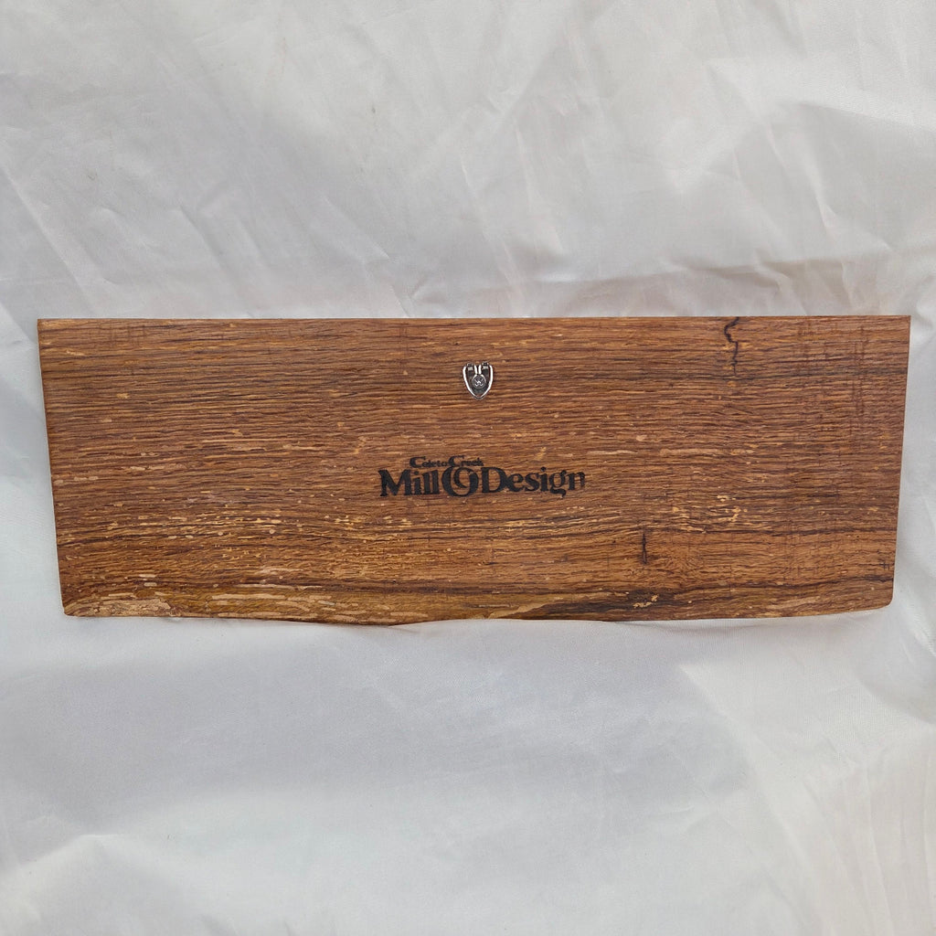 back view A rectangular white oak sign with a natural brown wood grain finish, featuring the word 'HOWDY' cut out in blue epoxy outline lettering, 