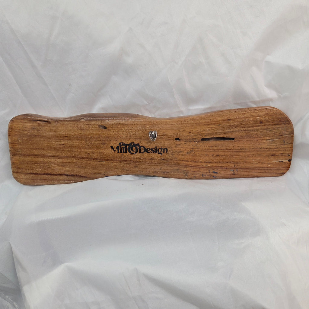back view A rustic, live-edge white oak sign featuring the word 'WELCOME' in a blue epoxy outline font carved into the natural wood grain, 