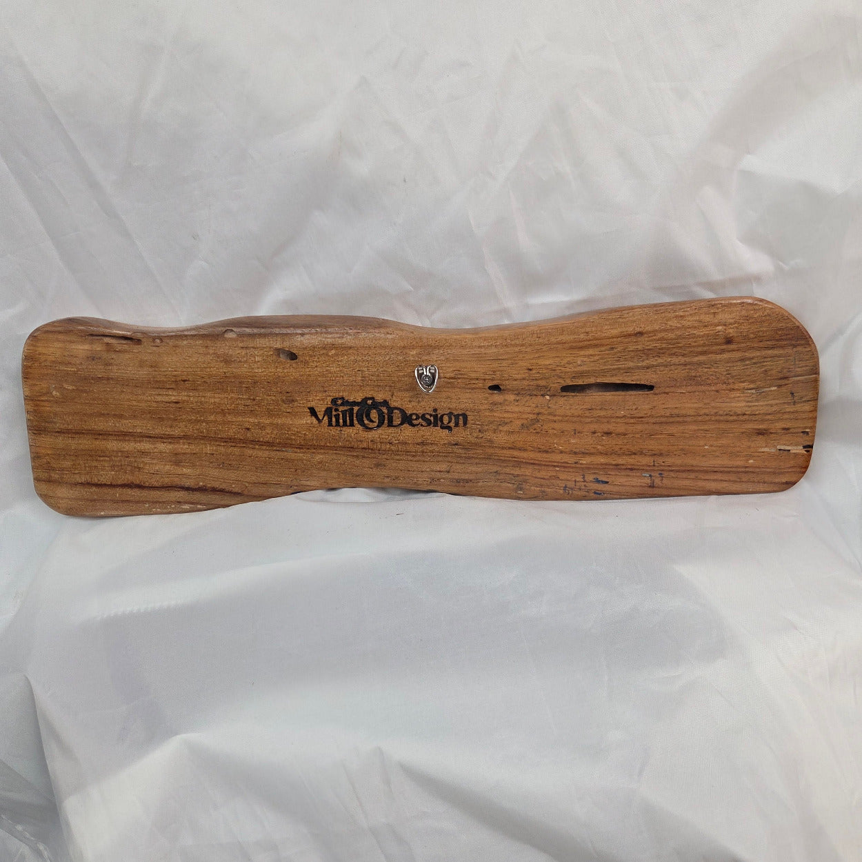 back view A rustic, live-edge white oak sign featuring the word 'WELCOME' in a blue epoxy outline font carved into the natural wood grain, 