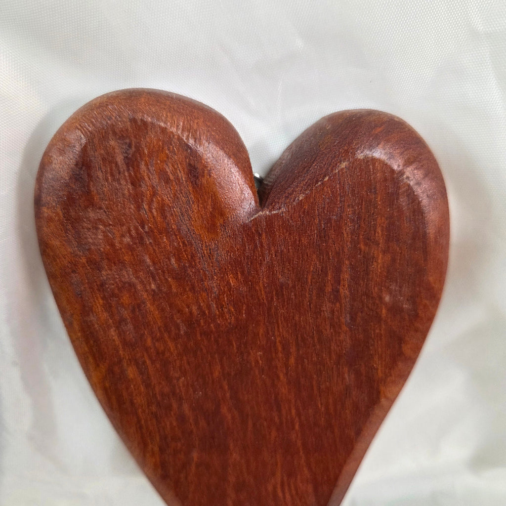 heart-shaped mesquite wall art with a polished finish, showcasing natural wood grain
