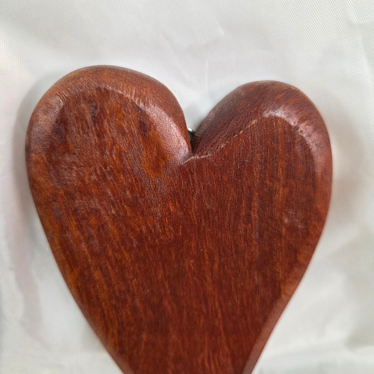 heart-shaped mesquite wall art with a polished finish, showcasing natural wood grain