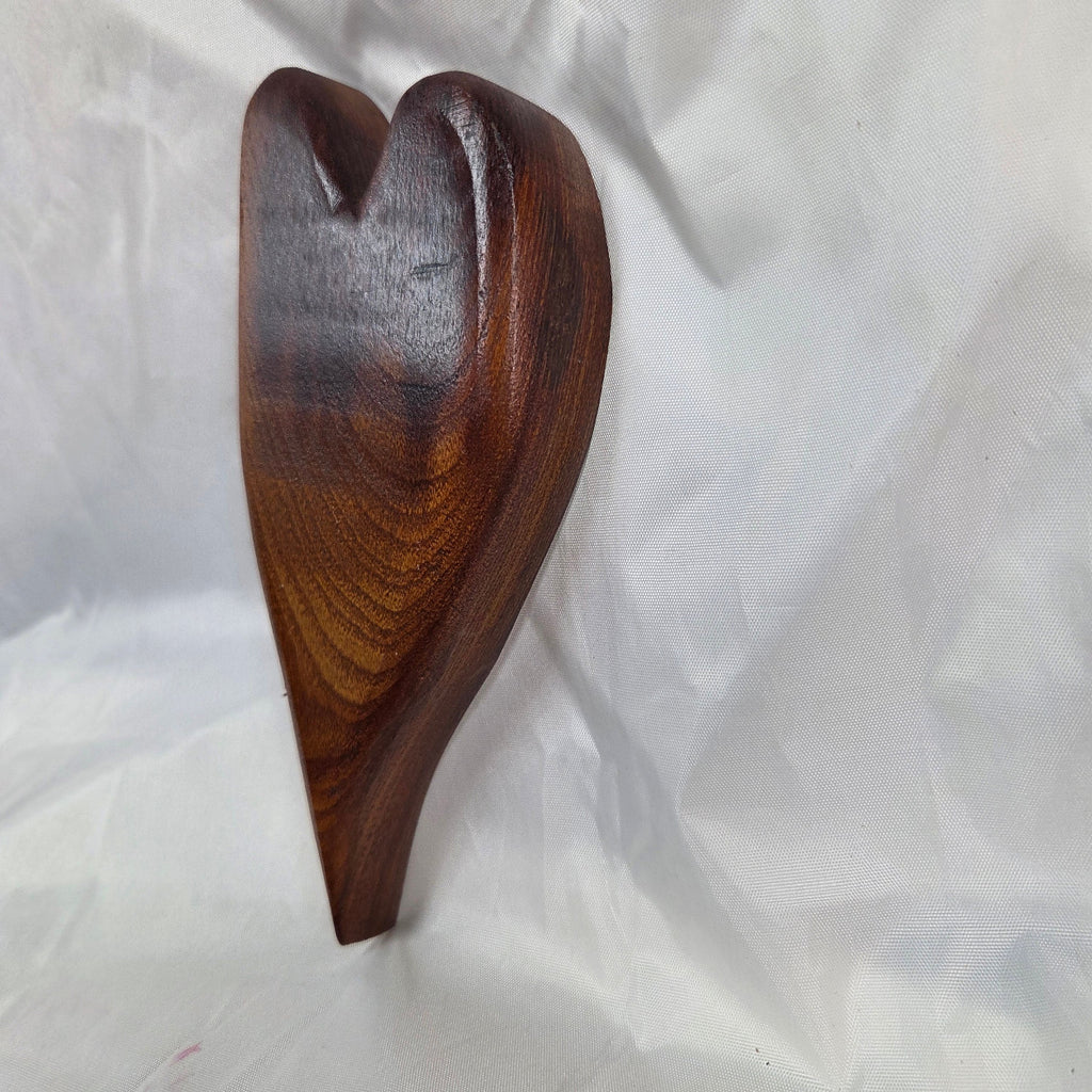 A heart-shaped mesquite handing plaque, showcasing natural wood grain