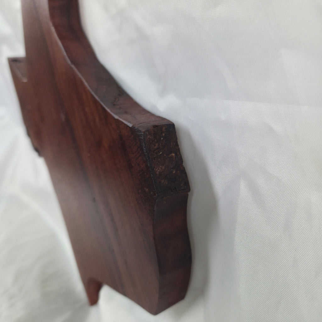 A carved mesquite wall plaque shaped like the state of Texas, with Blue epoxy fill and semi-gloss finish
