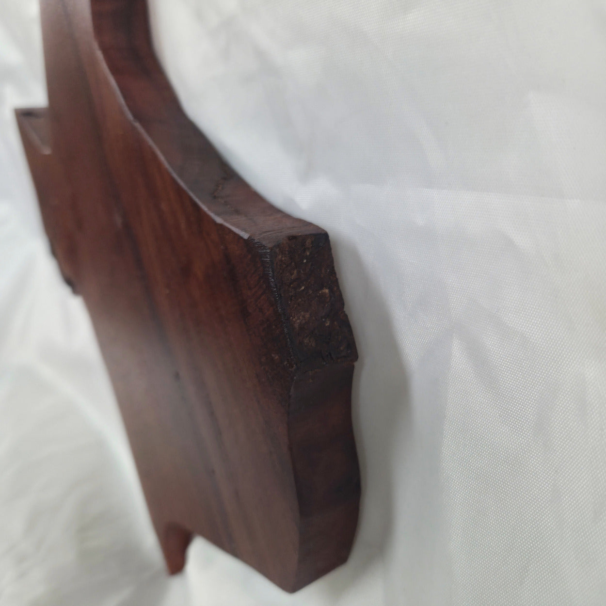 A carved mesquite wall plaque shaped like the state of Texas, with Blue epoxy fill and semi-gloss finish