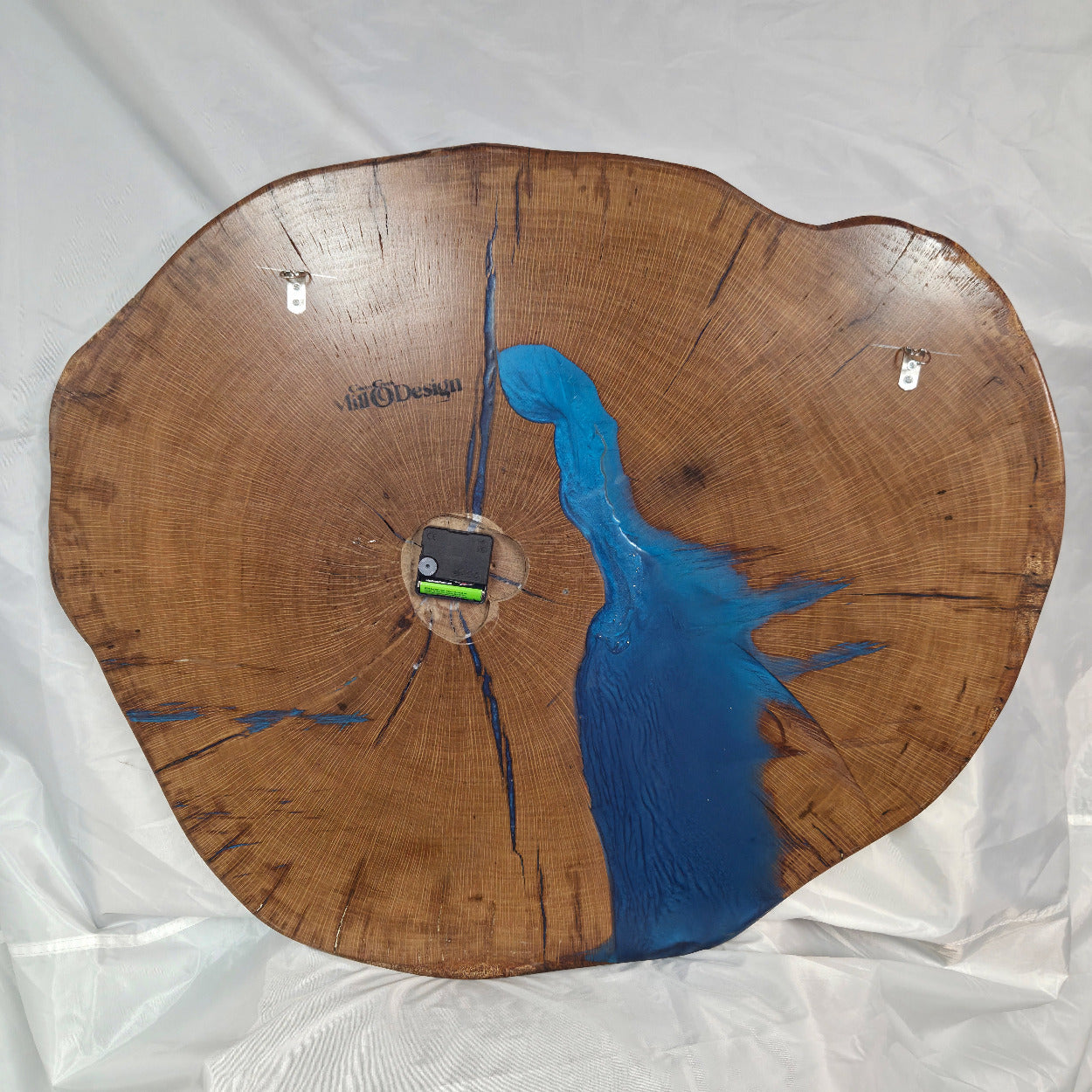 Large live edge Live Oak clock with wooden roman numerals with blue epoxy inlay and black clock arms
