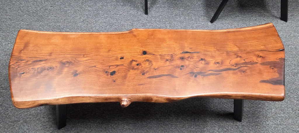 beautiful Bois D'Arc Bench Live edge rustic with black metal legs.