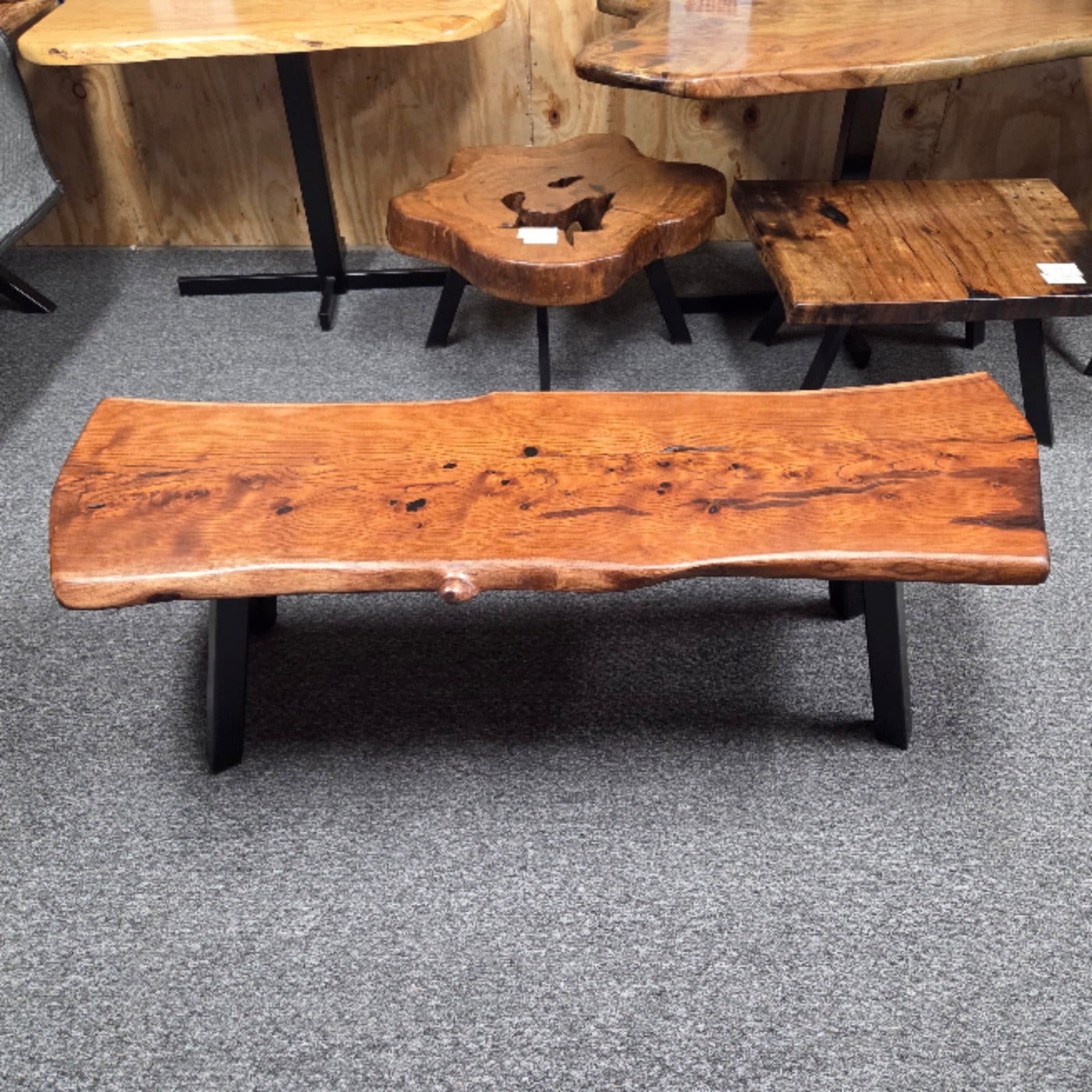 beautiful Bois D'Arc Bench Live edge rustic with black metal legs.