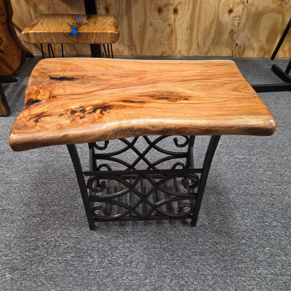 Hickory End Table with beautiful live edge sitting on metal basket style base.